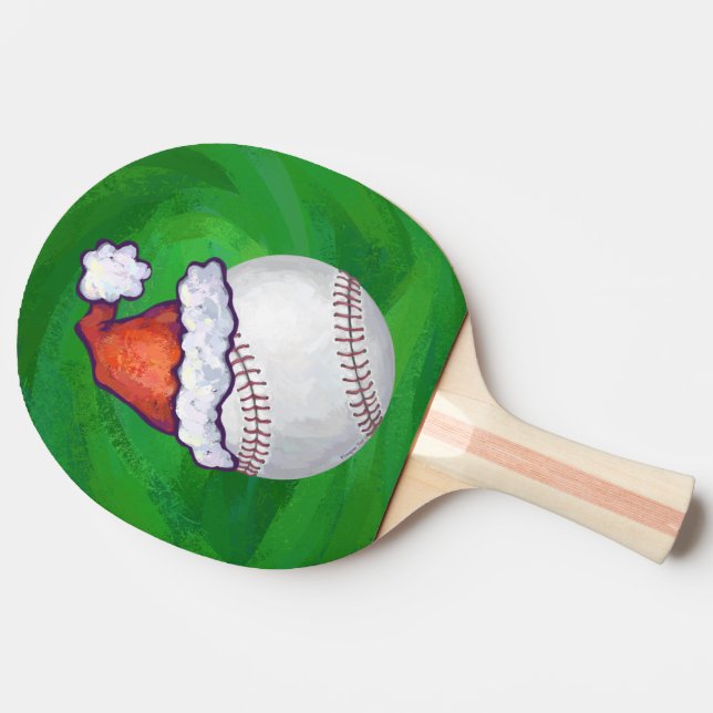 Baseball in Weihnachtsmannmütze über Grün Tischtennis Schläger (Seitenansicht)