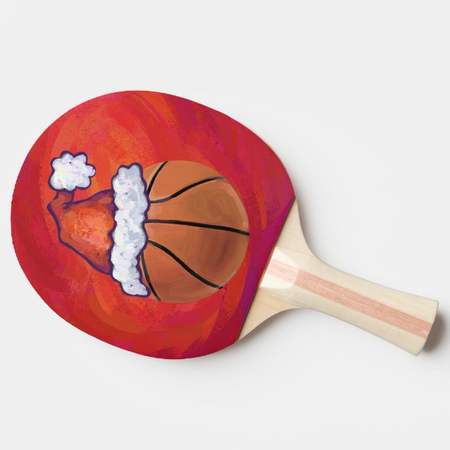 Basketball in Weihnachtsmannmütze Tischtennis Schläger (Seitenansicht)