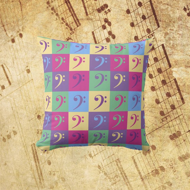 Bass Clef Musikmuster hell Kissen (A throw pillow with a colorful pattern of bass clef symbols.)