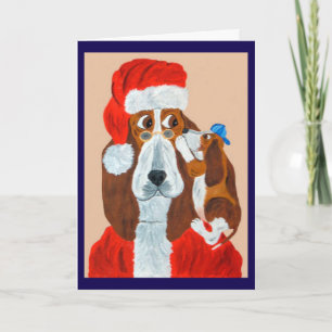 Basset-Welpe erzählt dem Weihnachtsmann seine Weih Karte