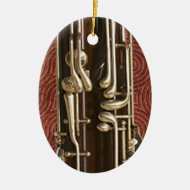 Bassoon-Schlüssel auf dunkelrotem Keramik Ornament (Vorne)