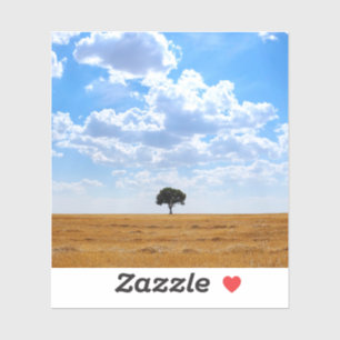 Baum auf einem geernteten Weizenfeld Aufkleber