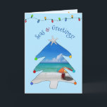 Beach Foto Meer und Grüße Weihnachtsbaum Feiertagskarte<br><div class="desc">Wünschen Sie ihnen Frohe Festtage vom Strand in dieser Ferienzeit mit dieser niedlichen Foto Strand Weihnachtskarte mit dem Gruß, "Seas & Greetings" in gewölbten Schriftart mit einem weißen Sandstrand, bunten Sonnenschirm, und Seele in einem skurrilen Weihnachtsbaum mit einem Seestern an der Spitze! Im Inneren der Karte zeigt Ihr Foto, und...</div>