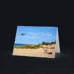 Beach Santa Greeting Card Feiertagskarte<br><div class="desc">Ein skurriler Weihnachtsgruß mit dem Weihnachtsmann und seinem Schlitten am Strand mit Skywriting-Flugzeug,  das eine frohe Weihnachtsbotschaft fliegt.</div>