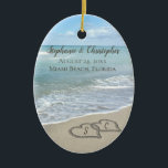 Beach Wedding Hearts in the Sand Elegant Keramik Ornament<br><div class="desc">Zwei ineinander greifende Hochzeitsherzen am Strand,  die im Sand gezeichnet werden,  machen eine elegante Hochzeit an der Küste des tropischen Ozeans nautische Thema,  passendes Set von Gegenständen. Hübsche türkisfarbene Wellen,  die am Ufer abstürzen und pastellblaue Himmel.</div>
