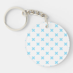 Bébé bleu croix coutures sur blanc