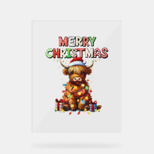 Bébé mignon vache Highland avec lumières de Noël