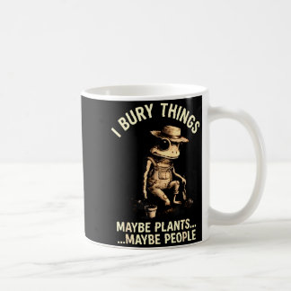 Begrabe Dinge, vielleicht Pflanzen, vielleicht Leu Kaffeetasse