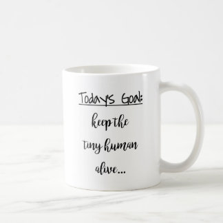 Behalten Sie das kleine menschliche lebendige Kaffeetasse