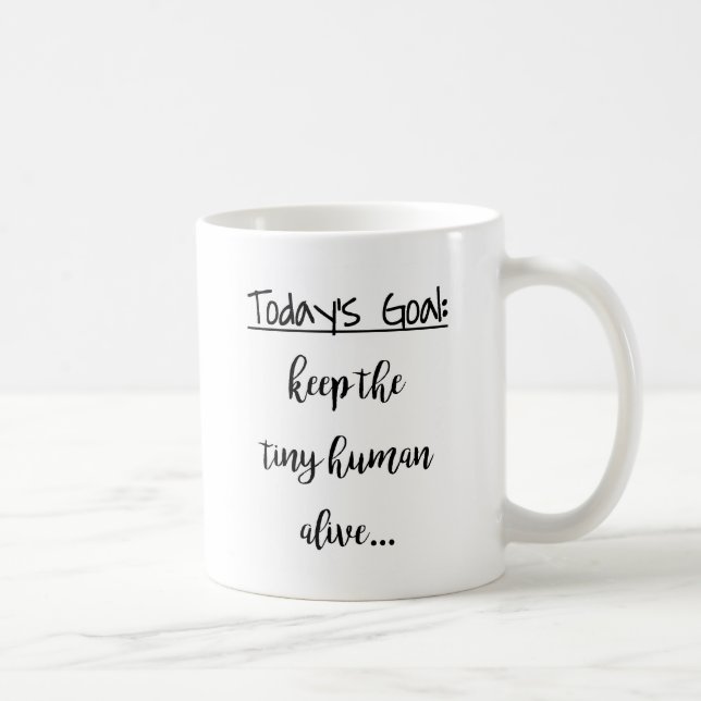 Behalten Sie das kleine menschliche lebendige Kaffeetasse (Rechts)