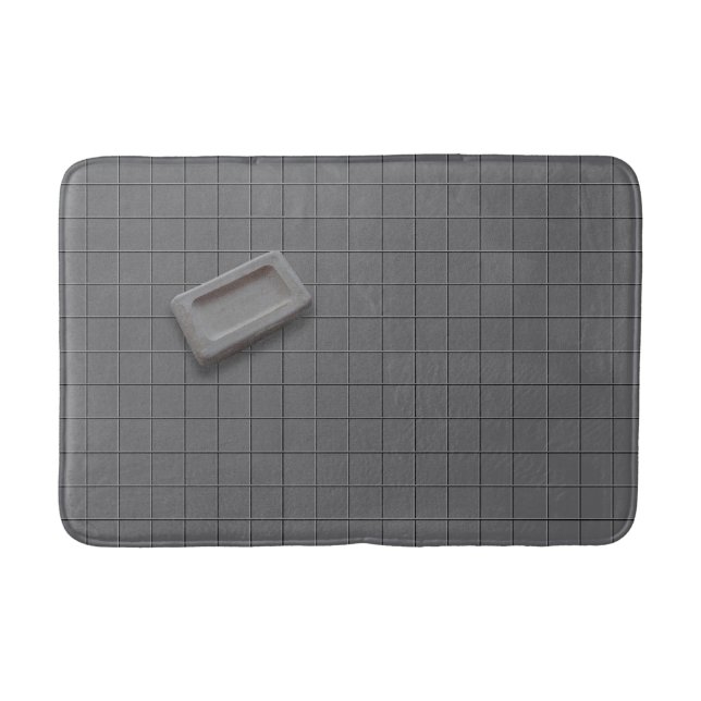 Beige graue Bar-Seife auf grauem Fliesenboden Badematte (Vorderseite)