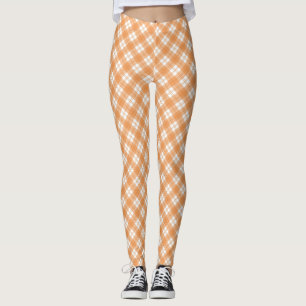 Beige und weiße karierte Leggings angezeigt