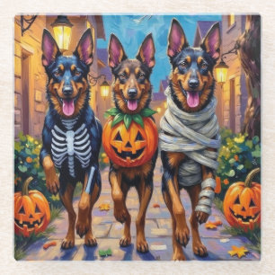 Belgische Schäferhunde beim Halloween-Süßigkeiten- Glasuntersetzer