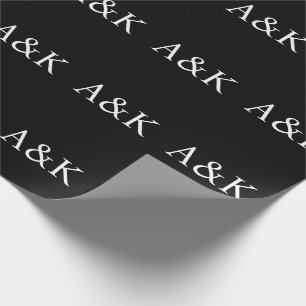 Benutzerdefinierte Anfangsbuchstaben auf schwarzem Geschenkpapier