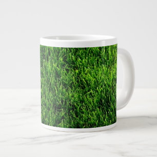 Beschaffenheit des grünen Grases von einem Jumbo-Tasse