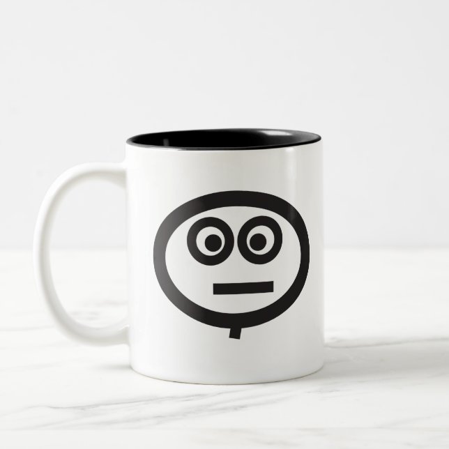 Betäubtes Gesicht Zweifarbige Tasse (Links)