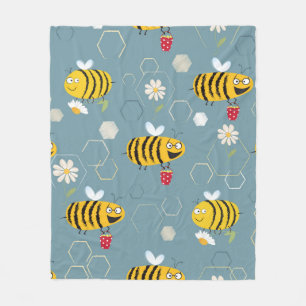 Bewohnte Bienen, die sich um die Blume bummeln und Fleecedecke