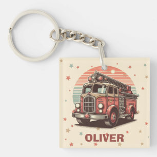 Bezauberender Retro-Feuerwehrwagen bei Sonnenunter Schlüsselanhänger