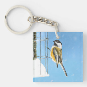 Bickadee sur la peinture d'alimentation - Oiseaux 