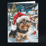 Biewer Terrier Dog Winter Wonderland Christmas Joy Karte<br><div class="desc">Dieses festliche Design spiegelt den fröhlichen Geist der Urlaubssaison wider und besticht durch ein hübsches Jungtier mit einer Weihnachtsmannmütze. Der Hund ist eingebettet in ein winterliches Wunderland, mit einem Schneemann, einem dekorierten Weihnachtsbaum und wunderschön verpackten Geschenken. Schneeflocken fallen sanft ab und geben der Szene eine magische Touch, während die lebhaften...</div>