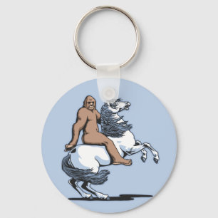 Bigfoot, der ein Einhorn reitet Schlüsselanhänger
