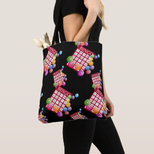 Bingo-Karten und Bingo-Bälle auf Schwarzem Tasche