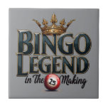 Bingo Legend Crowned in Gold Retro Typography Fliese<br><div class="desc">Celebrate your love for bingo with this bold and regal design featuring the phrase "Bingo Legend in the Making" in striking retro typography, topped with an ornate golden crown. The deep, rich hues and vintage aesthetic give this artwork a timeless appeal, perfect for those who enjoy the thrill of the...</div>