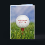 Birthday Golf Ball on T-Shirt für Sister Karte<br><div class="desc">Nahe Aufführung des Golfballs auf rotem Tee in grünem Gras zum Geburtstag der Schwester. Alle Texte können bearbeitet werden.</div>