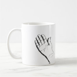 black and white hand on coffee mug