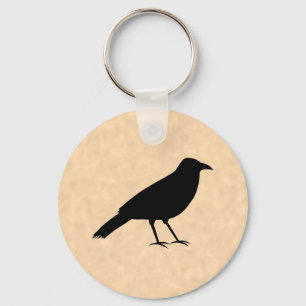 Black Crow Bird auf einem Parchment-Muster. Schlüsselanhänger