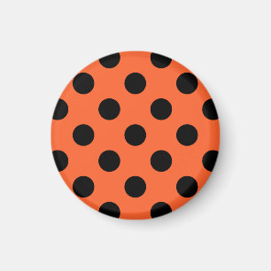 Black polka dots on orange magnet