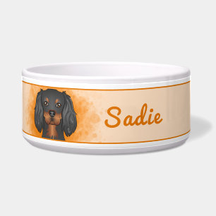Black & Tan Cavalier King Charles Dog auf Orange Napf