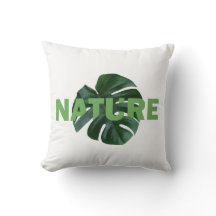 Blätter monstera auf weißem Kissen