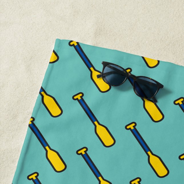 Blau- und Gelbflederpaddel auf Aquamarinen Strandtuch (Beispiel)