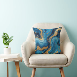 Blaue Flüssigkeit mit Tropfen und goldenem Glitzer Kissen