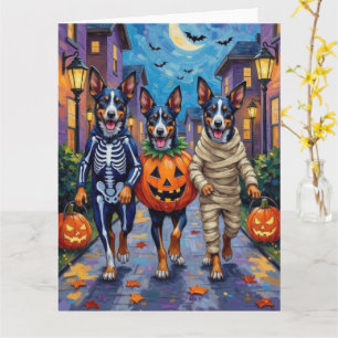 Blaue Heeler Hunde beim Trick-or-Treat an Hallowee Karte
