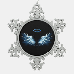 Blaue leuchtende Engelsflügel auf schwarzem Hinter Schneeflocken Zinn-Ornament
