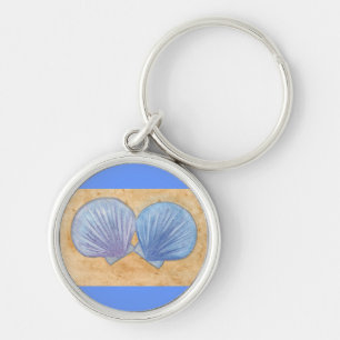 Blaue Lila Muscheln im Schlüsselanhänger Sand