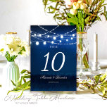 Blaue Nacht und Silberreihenleuchten Hochzeit Tischnummer<br><div class="desc">Erleben Sie Ihren Hochzeitsort mit unseren Blue Night & Silver String Lights Hochzeiten Tischnummern. Hören Sie auf, sich über Ihre Hochzeitsfeiern zu streichen, denn wir sind Ihr Partner für individuelle Hochzeitsfeiern und Tischnummern. Diese eleganten Tischnummern, die zauberhaft mit der Liebe von Mylini Design gestaltet wurden, werden durch das zauberhafte Licht...</div>