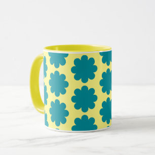 Blaue Retro-Blumenkunst auf gelber Tasse