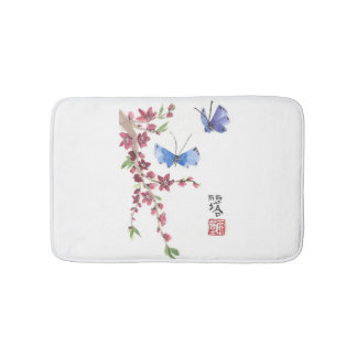 blaue Schmetterlinge und rosa Blumen Badematte