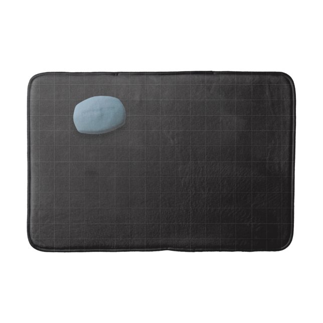 Blaue Seife auf schwarzem Tile Badematte (Vorderseite)