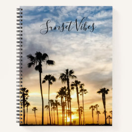 Blaue und gelbe Wolkendecke Palmen Sonnenuntergang Notizbuch