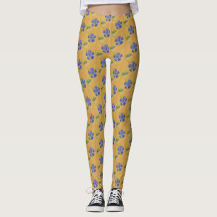Blaue Vinca, Perwinkl auf einem gelben Hintergrund Leggings