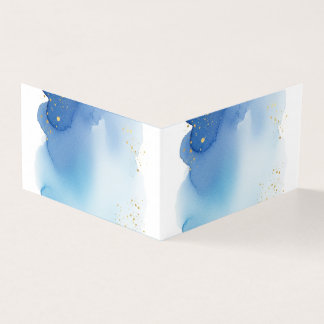 Blaue Wasserfarbspritzer mit goldenen Glitterpunkt