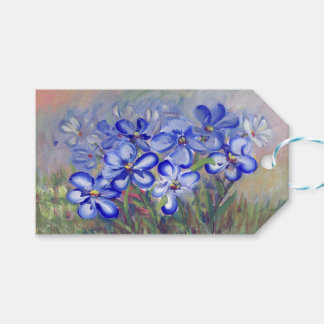 Blaue Wildblumen in einem Kunsthandwerk Geschenkanhänger