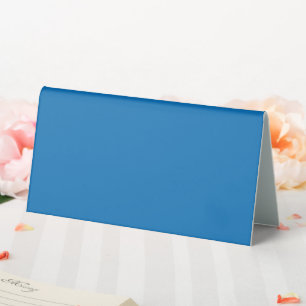blauer Hintergrund mit schwarz-weißer Uhr Tischaufsteller