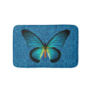 Blauer Schmetterling auf blauem Glitzer Badematte