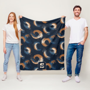 Blauer und brauner Kreis auf dunklem Hintergrund Fleecedecke