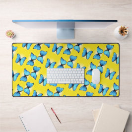Blaues Schmetterlingsmuster auf gelb Schreibtischunterlage
